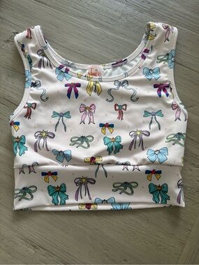 Shop the Magic Box Disney Princess Bow Print Cropped Sports Active Top